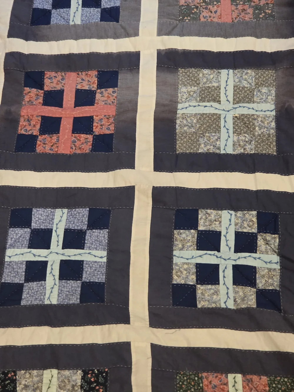 Patchwork Navy and Cream Quilt with Blue and Coral Accents